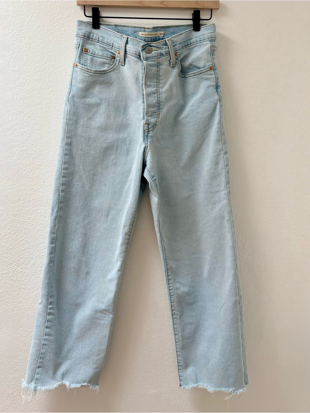 Levi’s Light Blue Raw Hem Ribcage Straight Ankle Jeans
